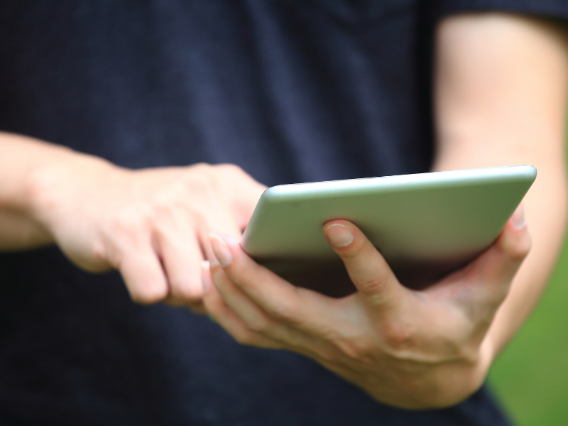 Workman using custom software on a tablet